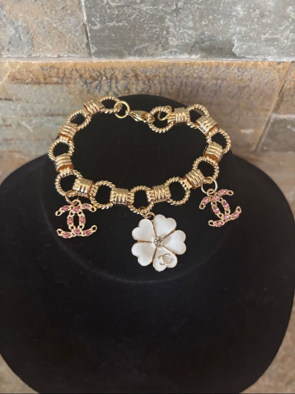 Gold plated Bracelet with White Designer Flower charm.